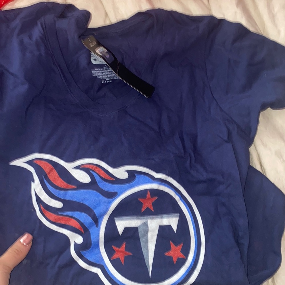 Tennesse titans decker shirt. Never worn. New with tags but a little wrinkled